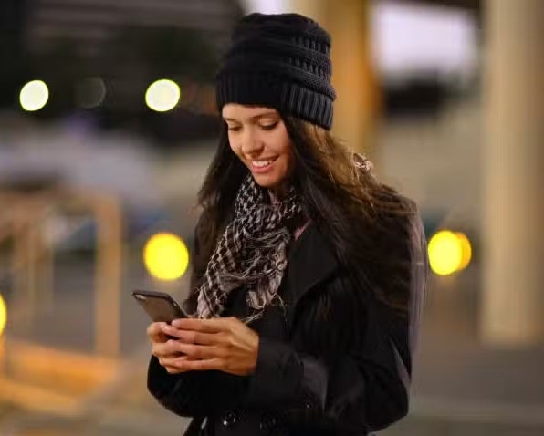 Girl with hat on phone