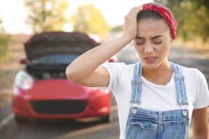 Woman having a headache after a car accident in Georgia