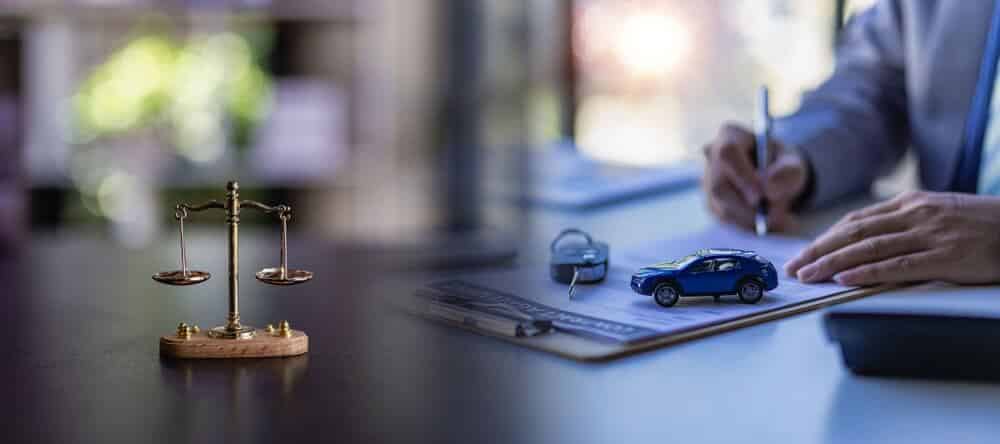 car auction concept and car keys on a wooden table with golden scales concept of selling a car by auction or law ah fair